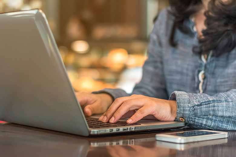 High school student taking Wake Forest's online psychology course on a laptop